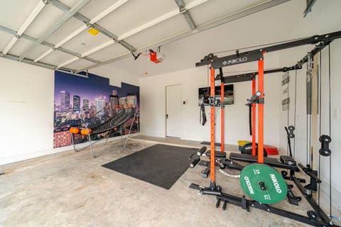 Garage gym with power rack + hoops game—work out and play at home.