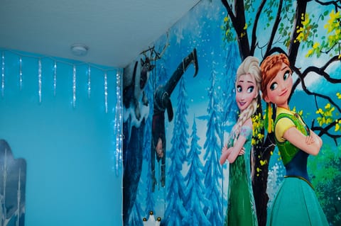 Enchanting Frozen-themed room with colorful mural and icy magical details
