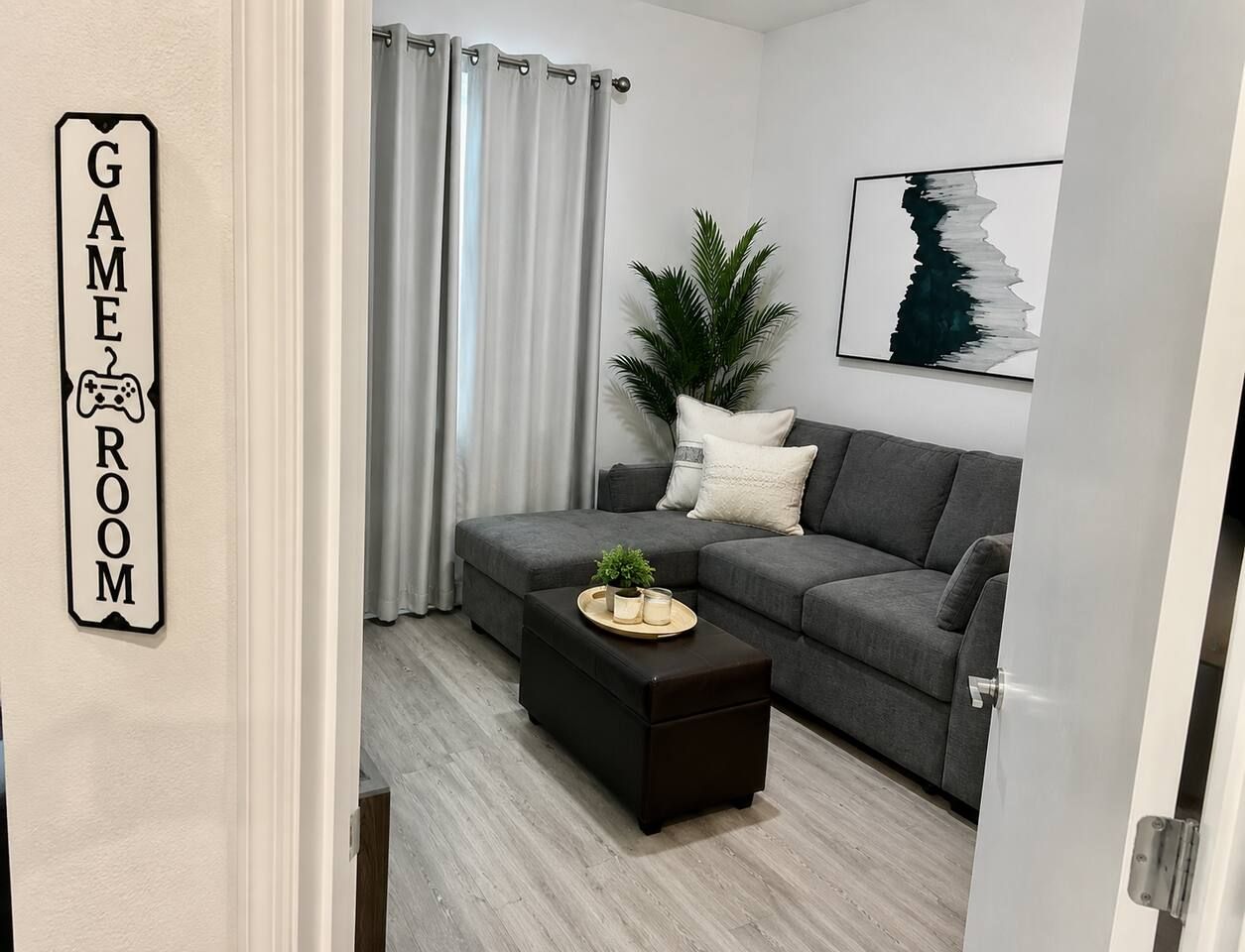 This flexible space is designed for fun and relaxation.  It is perfect as a games room, movie lounge, hangout spot for family and friends. The sofa converts into a double bed. This room has a door and large closet! 