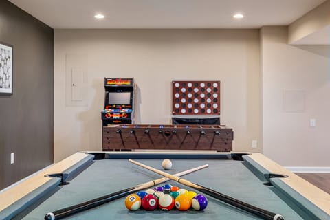 Modern game room: pool, foosball, and retro arcade—fun for everyone