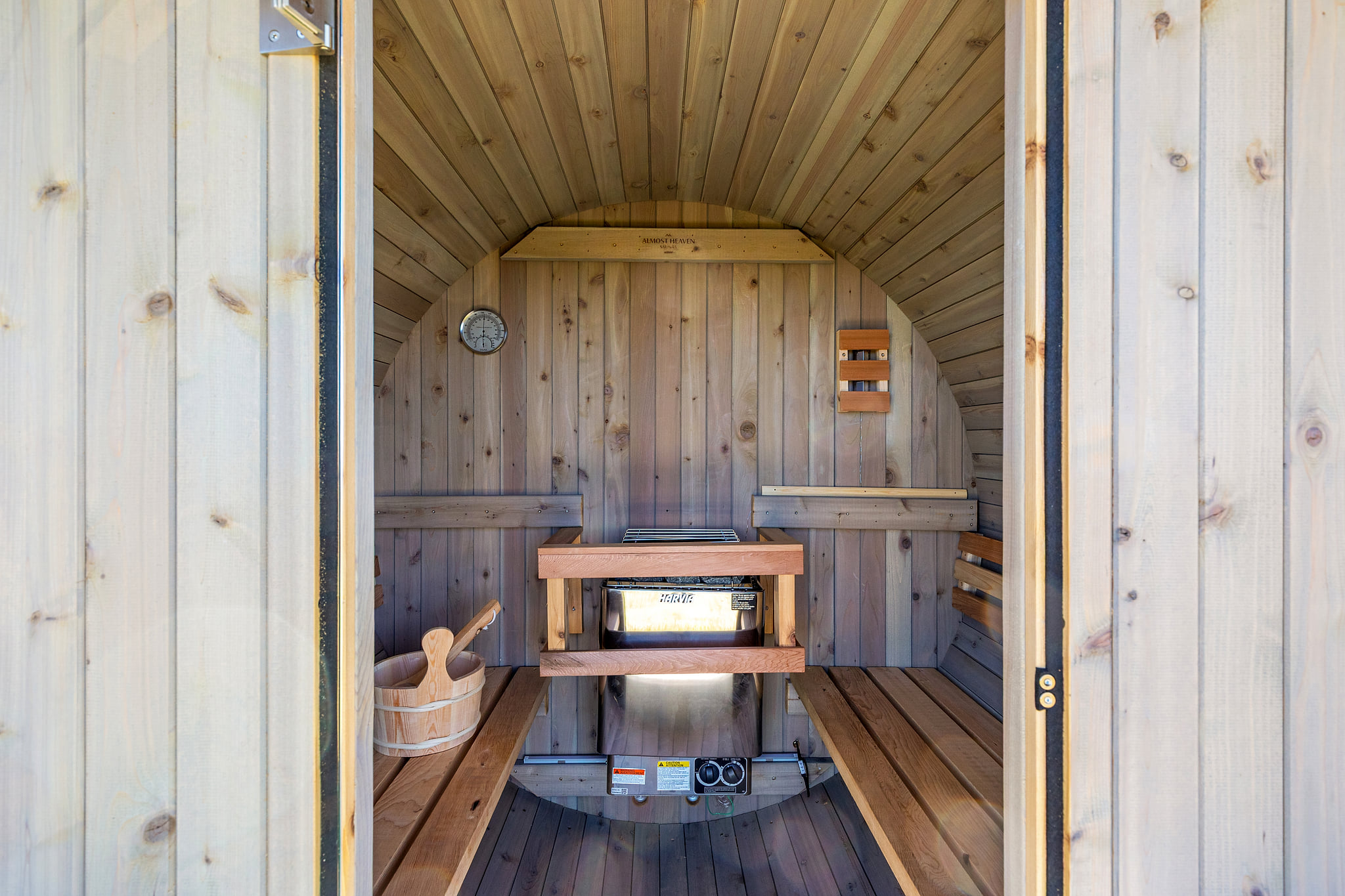 Private cedar barrel sauna—your onsite spa retreat with bench seating