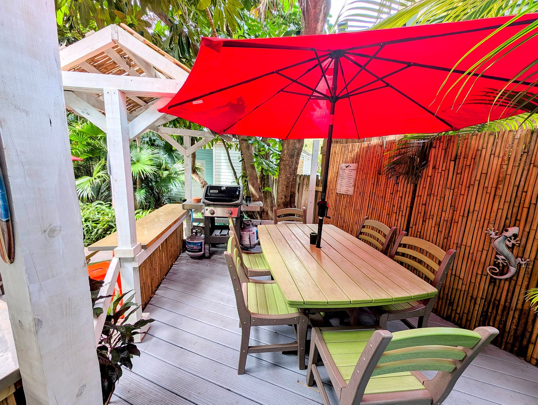 Tropical patio with grill, gazebo bar, and shaded dining for 6