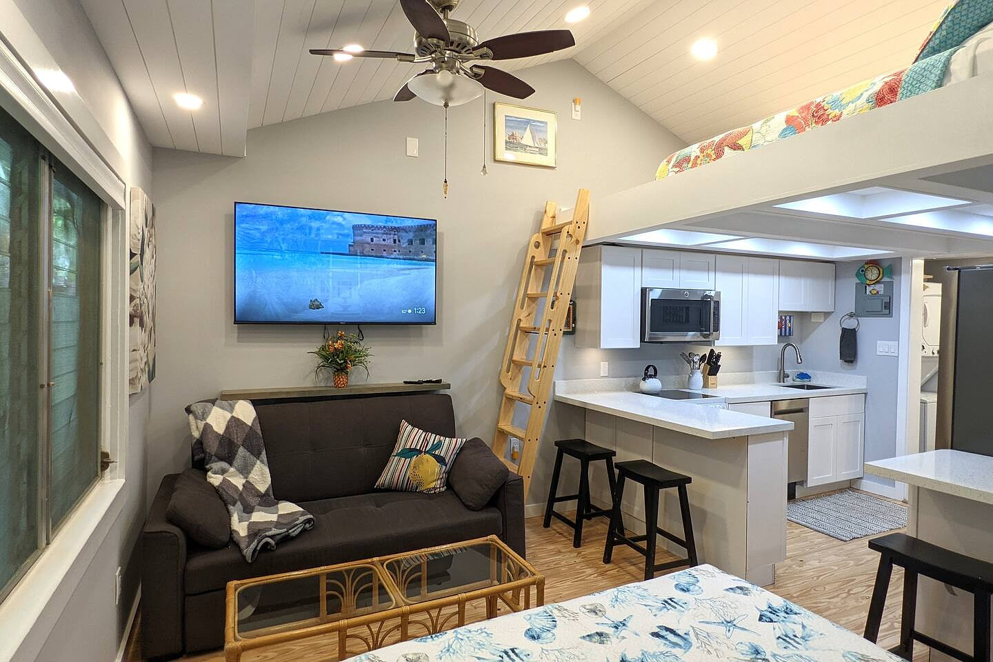 Fully equipped kitchen with queen loft above. Sofa, 55 inch smartTV.