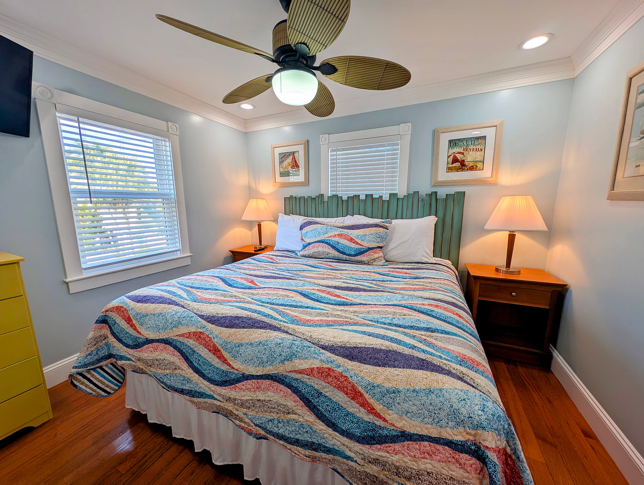 Cozy coastal king bedroom with fan, hardwoods & natural light