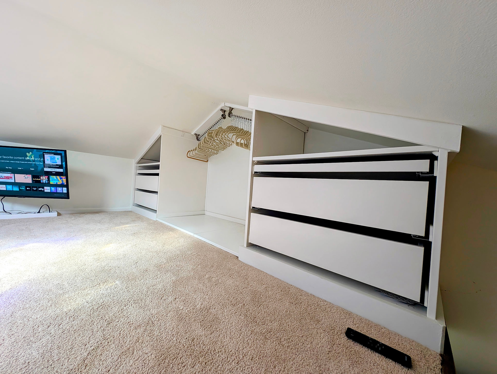 Cozy loft with smart TV and ample built-in under-eave storage