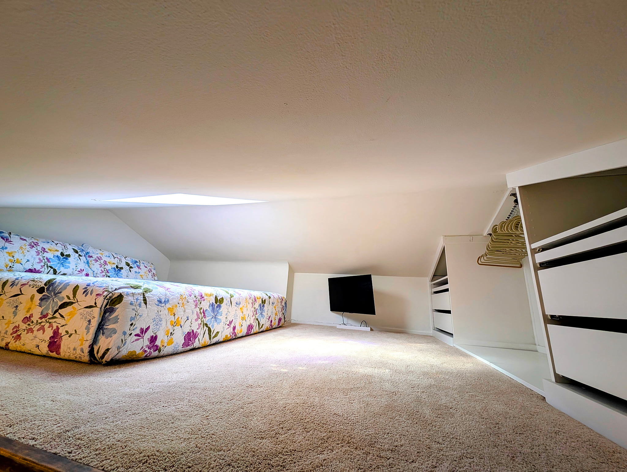 Cozy loft retreat with skylight, TV, and built-in storage. Beach House Modern Old Town Studio Near Duval