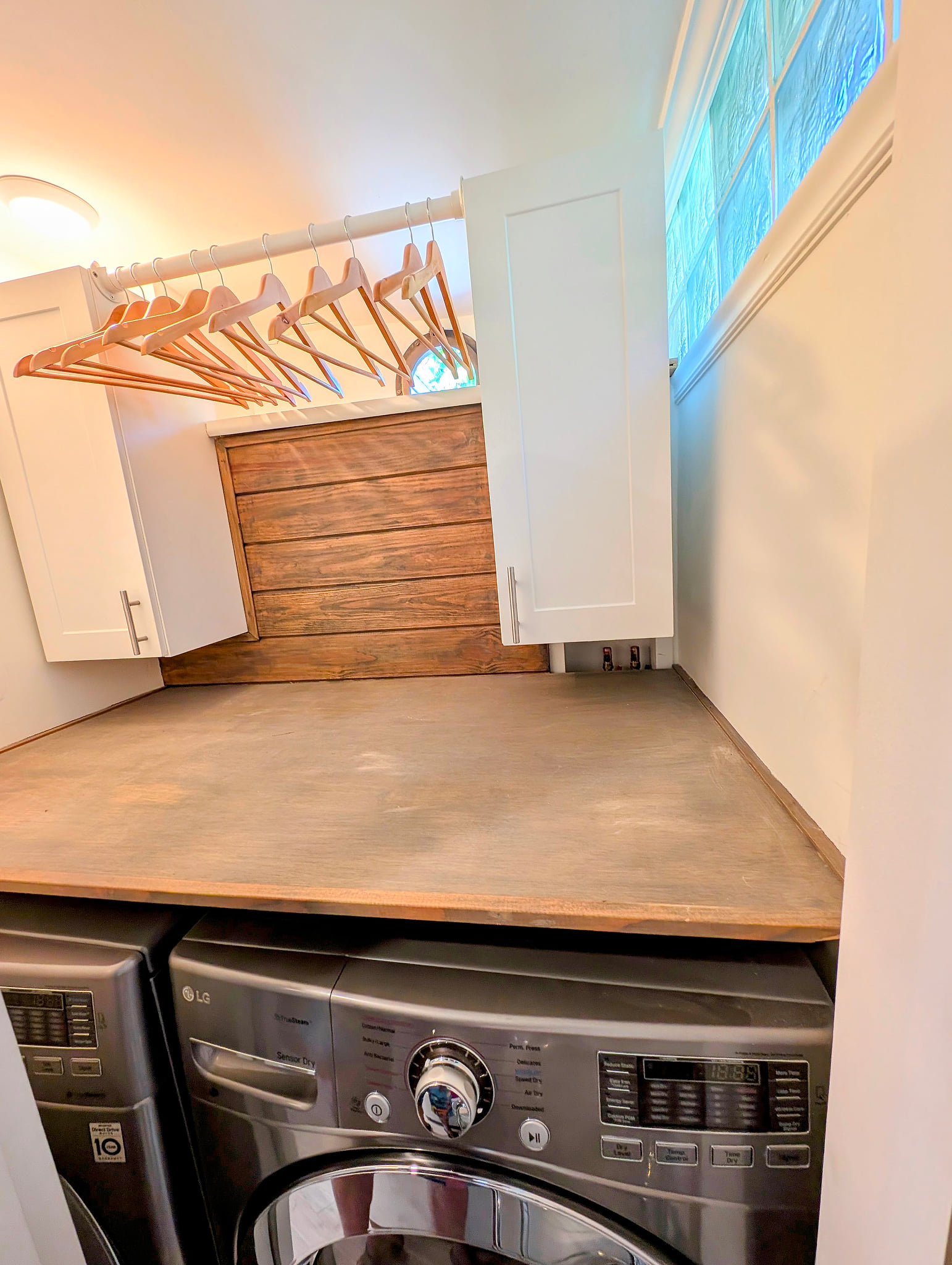 Laundry nook with LG washer/dryer, folding counter & hang space