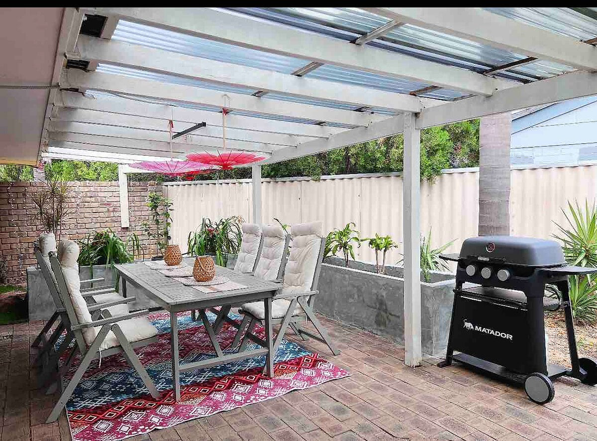 Outdoor Lounge surround by plants Edgewater Whole Holiday Resort