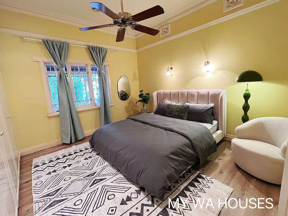 Enjoy a super soft king bed and English garden in the large bedroom