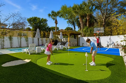 Family fun starts right in the backyard with a private putting green, basketball court, pool, and plenty of space to play.
