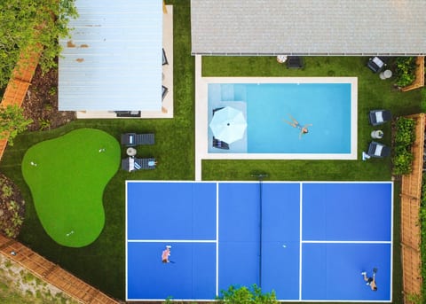 Designed for both relaxing and playing, this backyard has everything you need for the perfect stay.