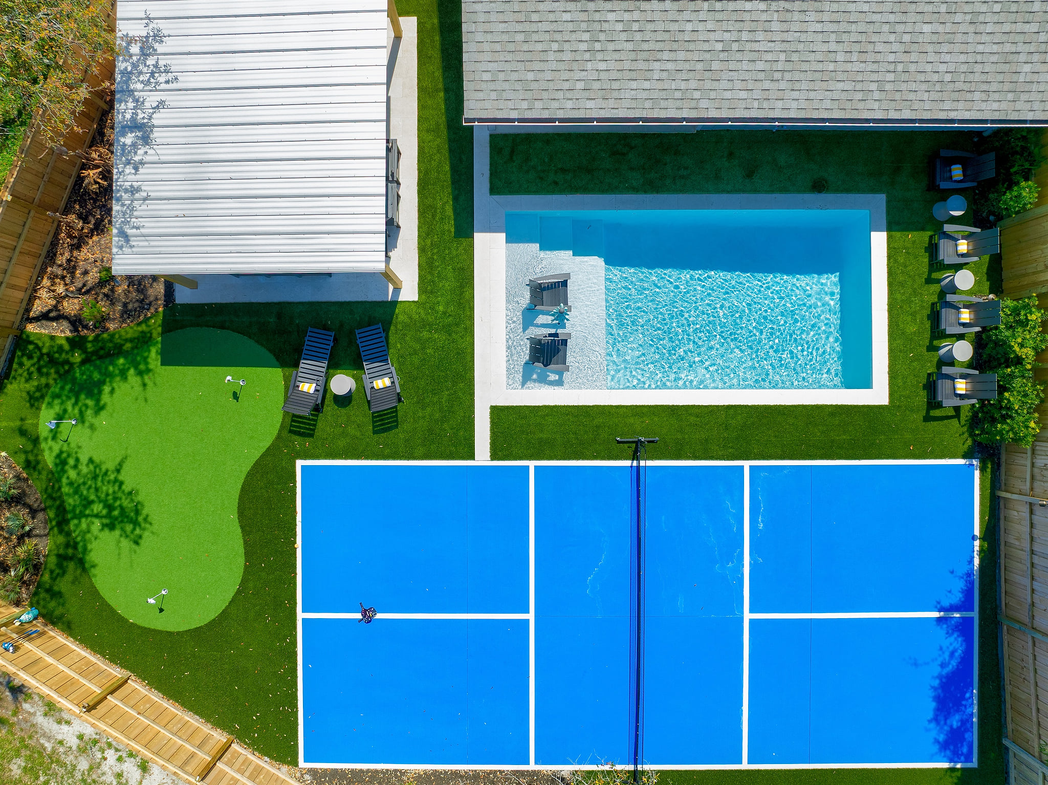 Designed for both relaxing and playing, this backyard has everything you need for the perfect stay