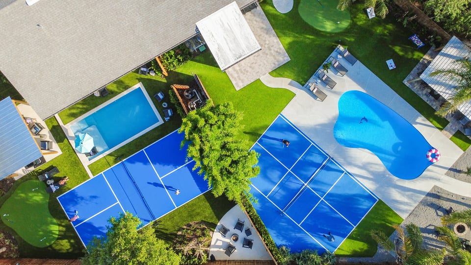 Bird's-eye view of your private backyard oasis - 2 pools, 2 pickleball courts, 2 putting greens, 2 fire pits - one unforgettable vacation