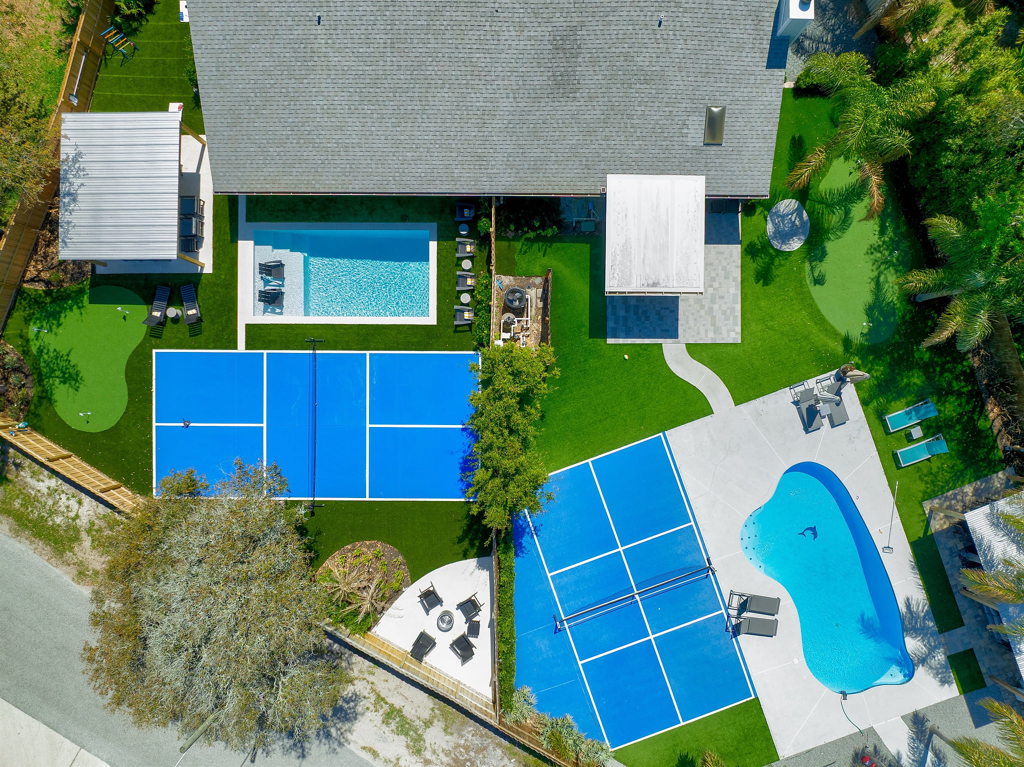 Bird's-eye view of your private backyard oasis - 2 pools, 2 pickleball courts, 2 putting greens, 2 fire pits - one unforgettable vacation