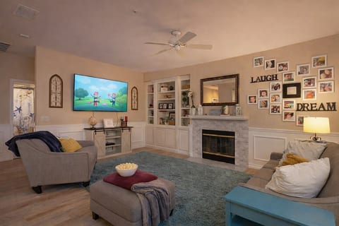 Living room attached to the kitchen. 70" Screen Smart TV.