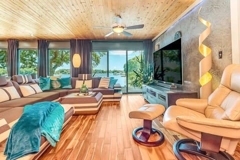 Enjoy the modern living room while overlooking Lake Norman and the 75" TV