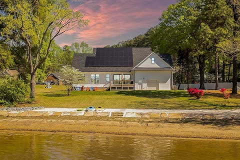 Lakefront house with private beach, boat dock, and boat ramp
