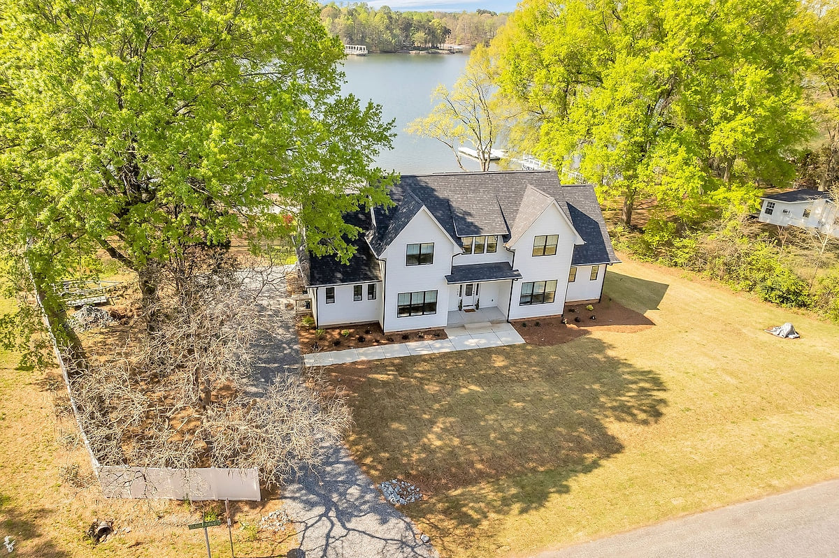 Lakefront house with private beach, boat dock, and boat ramp