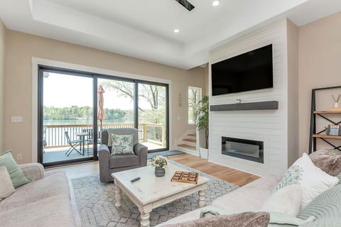 Fireplace and smart tv in living room overlooking the Lake