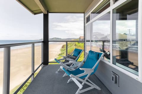 Peaceful deck view with coastal charm.
This north-facing balcony offers a front-row seat to Newport’s stunning shoreline. The lighthouse is just out of frame, but you'll spot its beam at night.