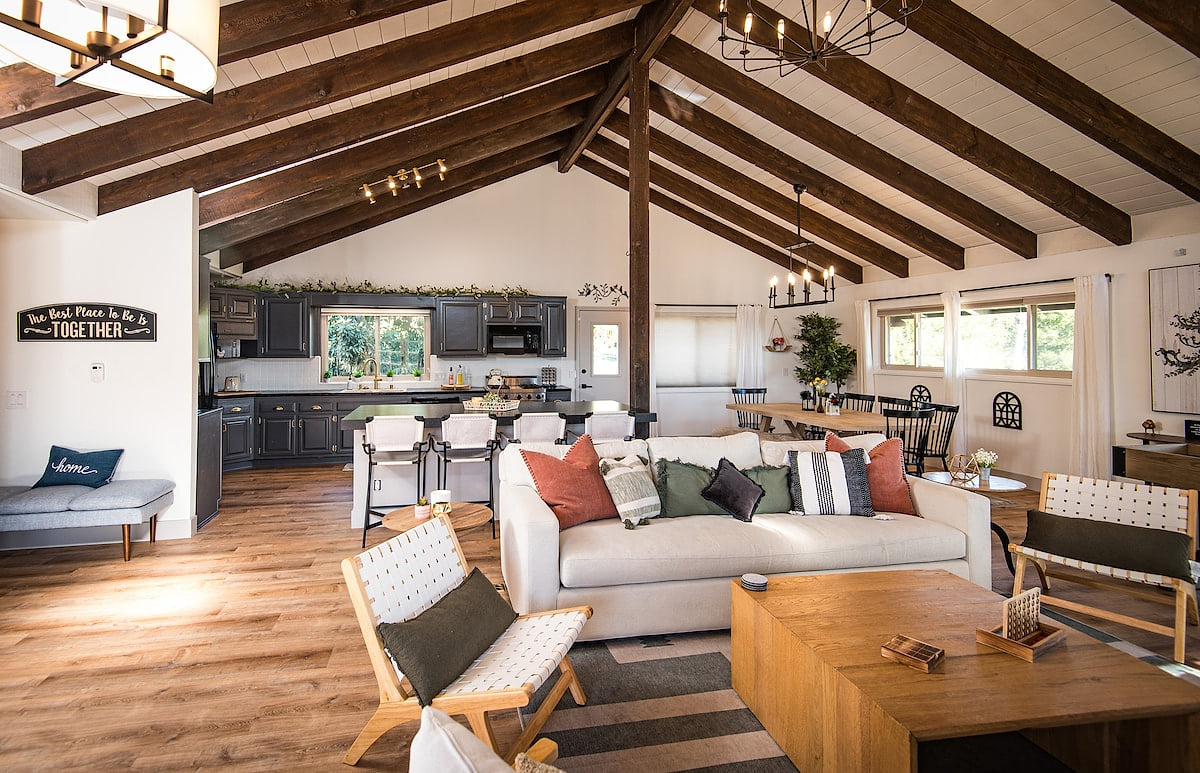 Seating for 8 in front of the TV and fireplace. Great area to chat. Kitchen is open and right behind the couch. Huge island with seating. 