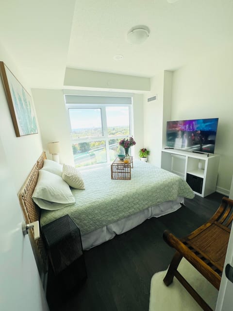 Comfortable and chic bedroom with flatscreen SMART TV