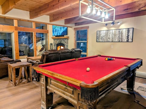 Pool table, on the main floor adjacent the living room.