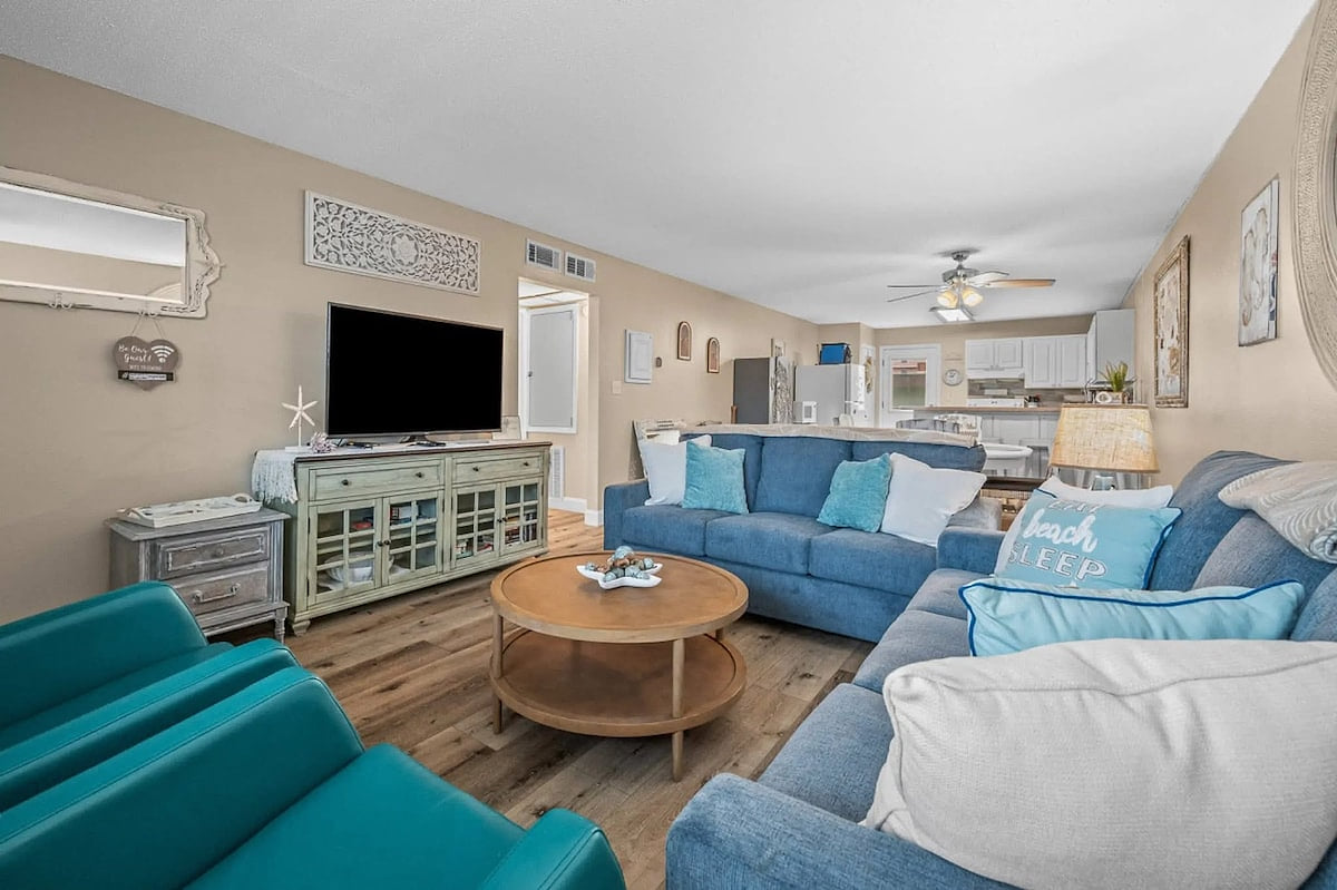 Two recliners, smart tv, and 2 sofa beds