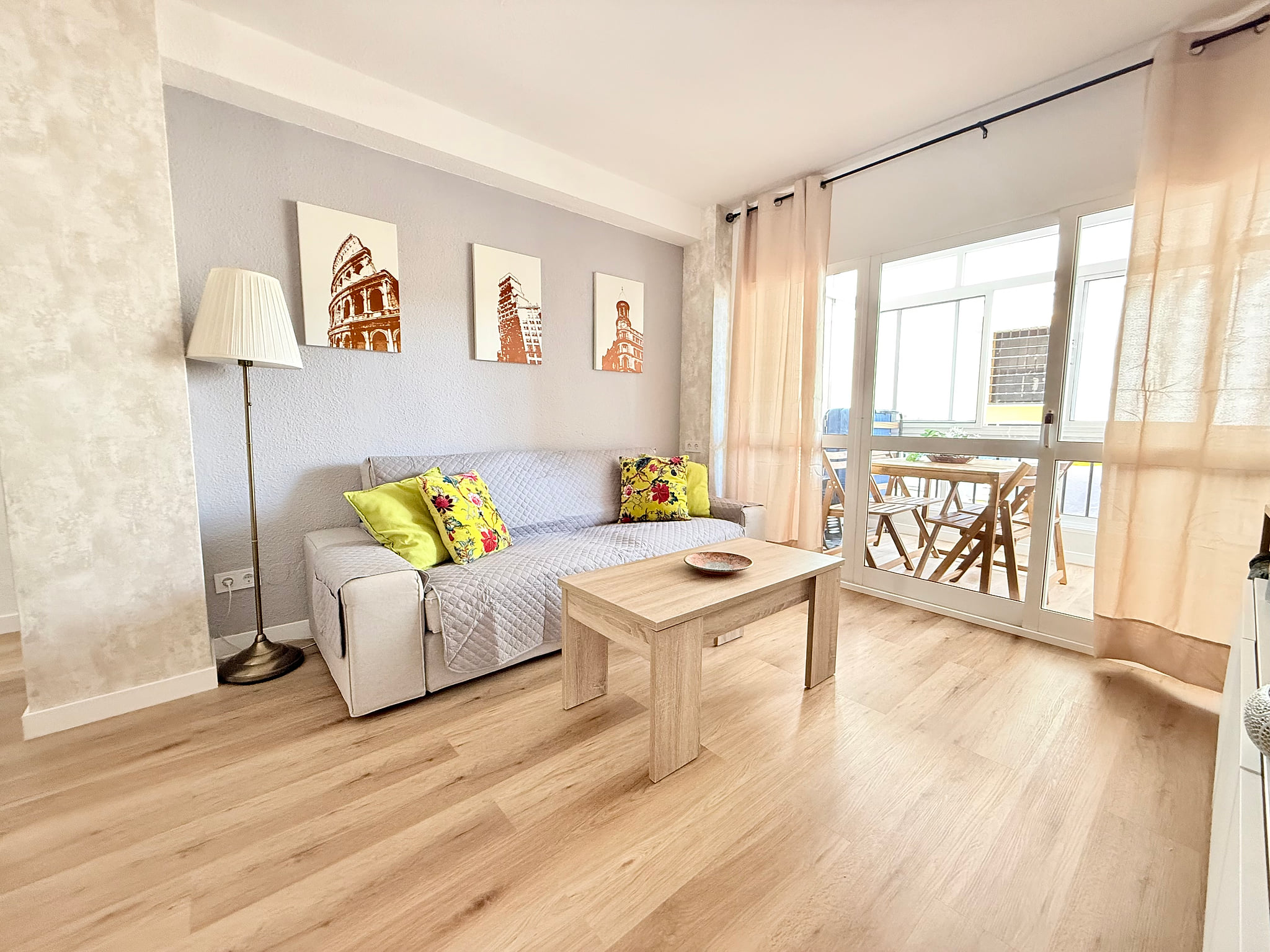 Bright lounge with sunroom balcony, modern decor and wood floors