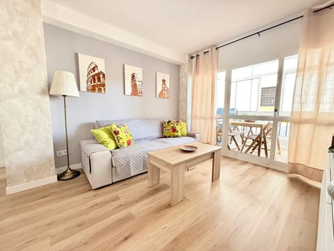 Bright lounge with sunroom balcony, modern decor and wood floors