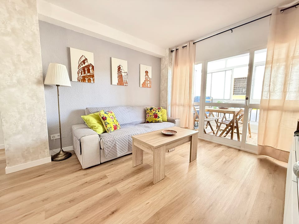 Bright lounge with sunroom balcony, modern decor and wood floors