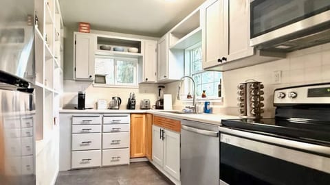 Bright kitchen with new appliances.  Fridge features an ice maker!  Keurig coffee maker.