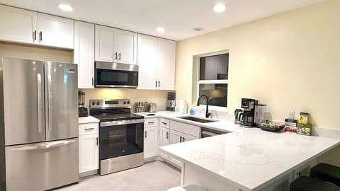 Large chef's kitchen with dishwasher & quartz countertops