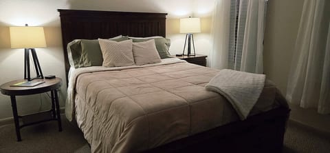 Our queen sized bedroom is beautifully decorated and cozy.