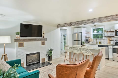 Living Room and Kitchen View (Seating is a loveseat and two chairs)