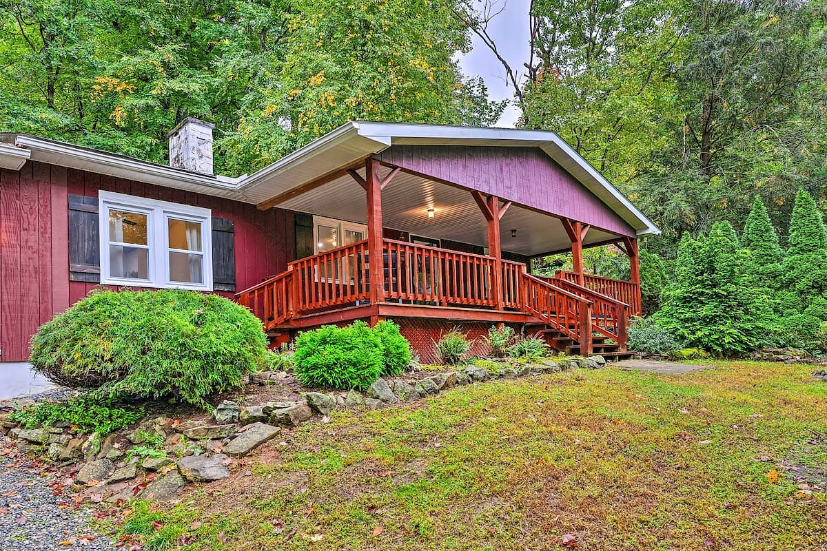 Front of house. Steep gravel driveway, light slope to get to porch