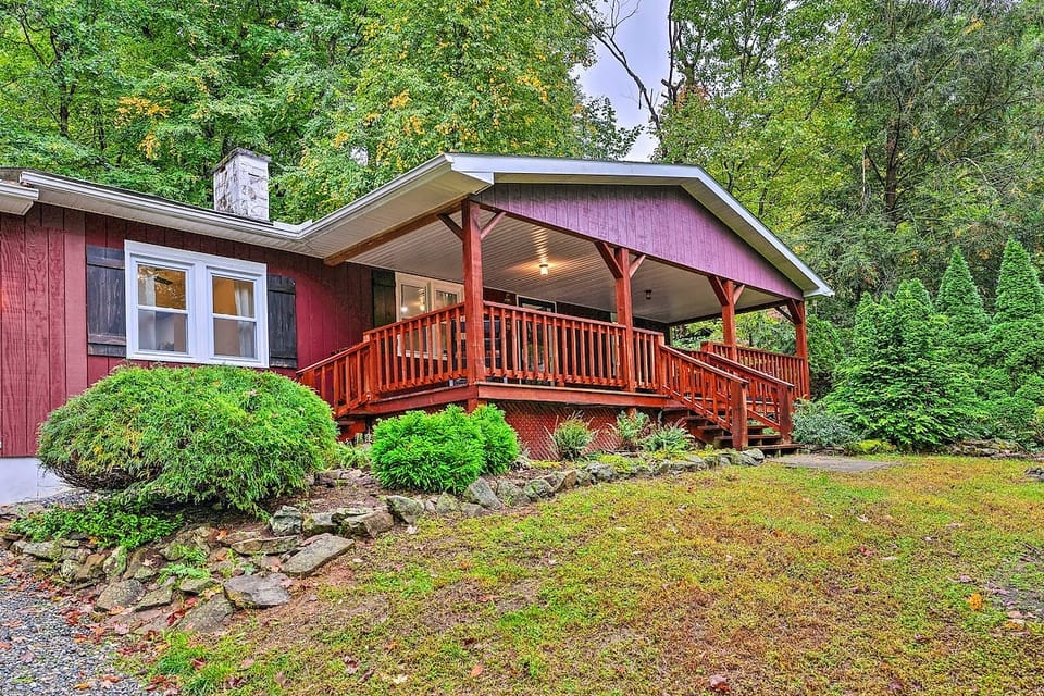 Front of house. Steep gravel driveway, light slope to get to porch