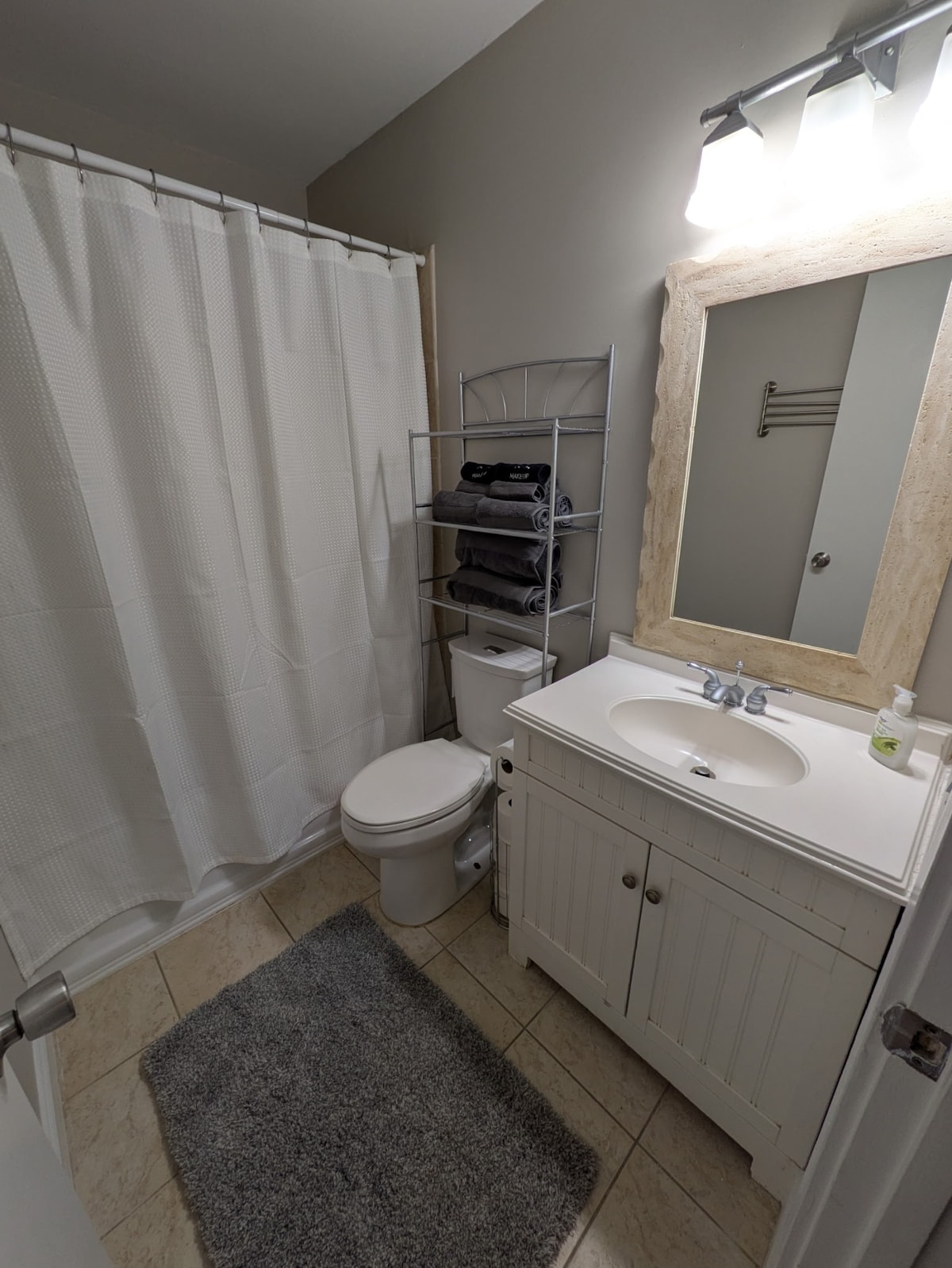 Top floor hallway bathroom with bath/shower.