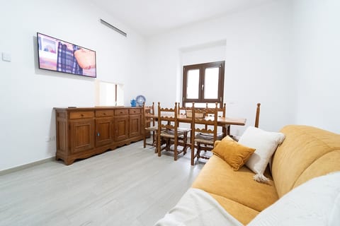 Living room with large table and smart TV
