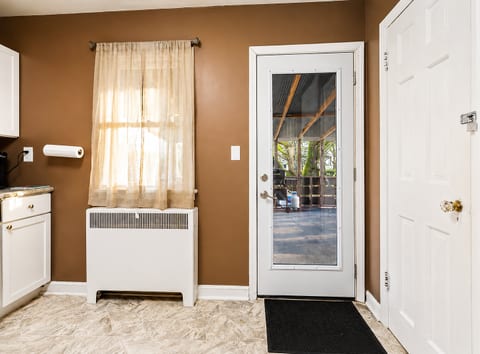 Bright entry with natural light and easy access to covered outdoor patio