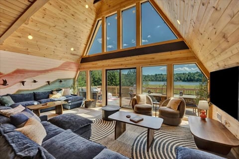 Living Room: Spacious, stunning lake views and two comfortable couches seating for large gatherings