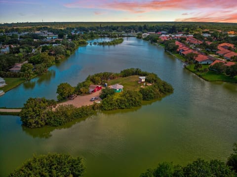 Waterfront tiny home sits on a private 1.5 acre inland peninsula! The perfect location for bird watching & kayaking around the lake. 