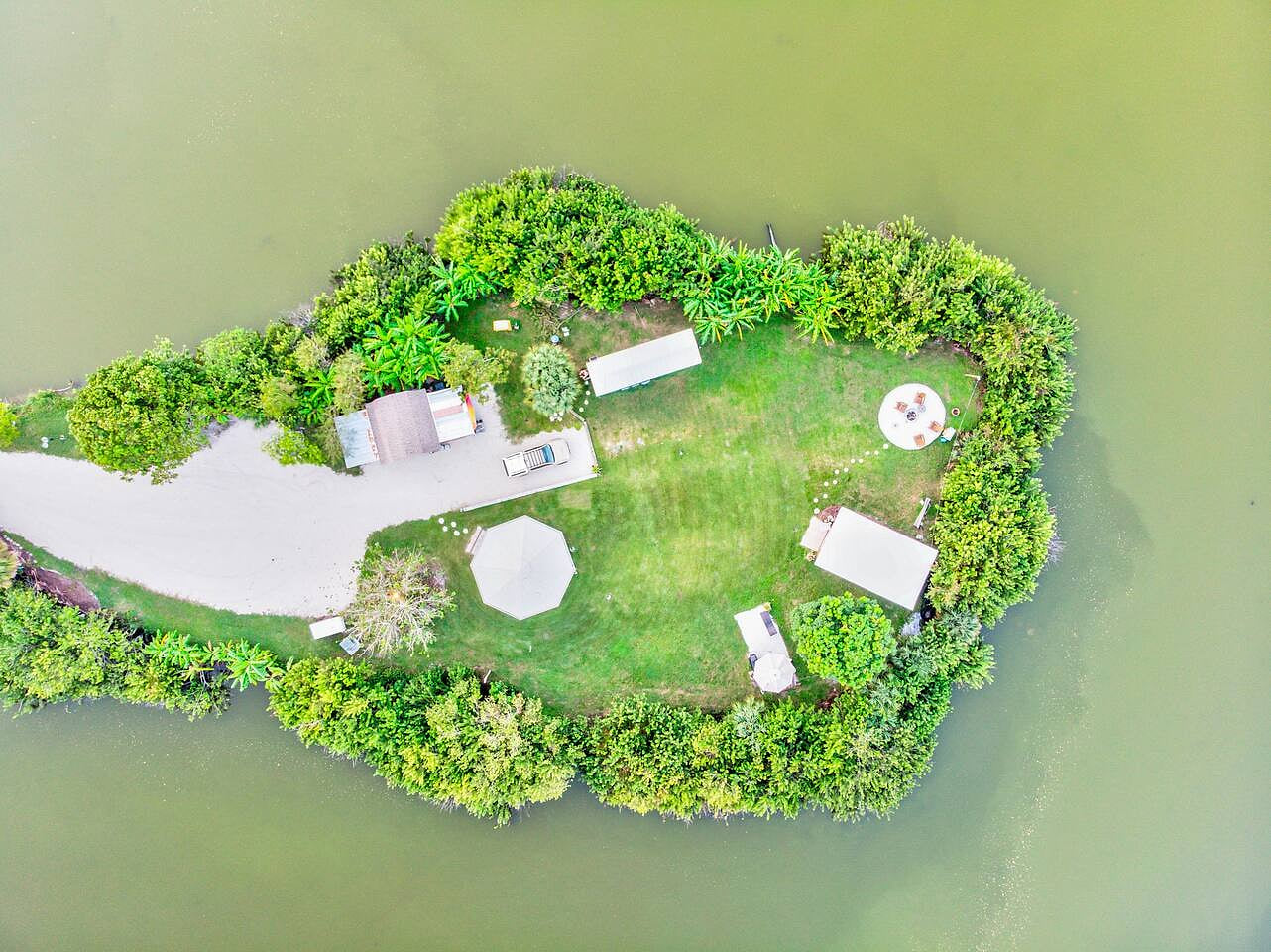 The tiny home sits on a private 1.5 acre inland peninsula! 