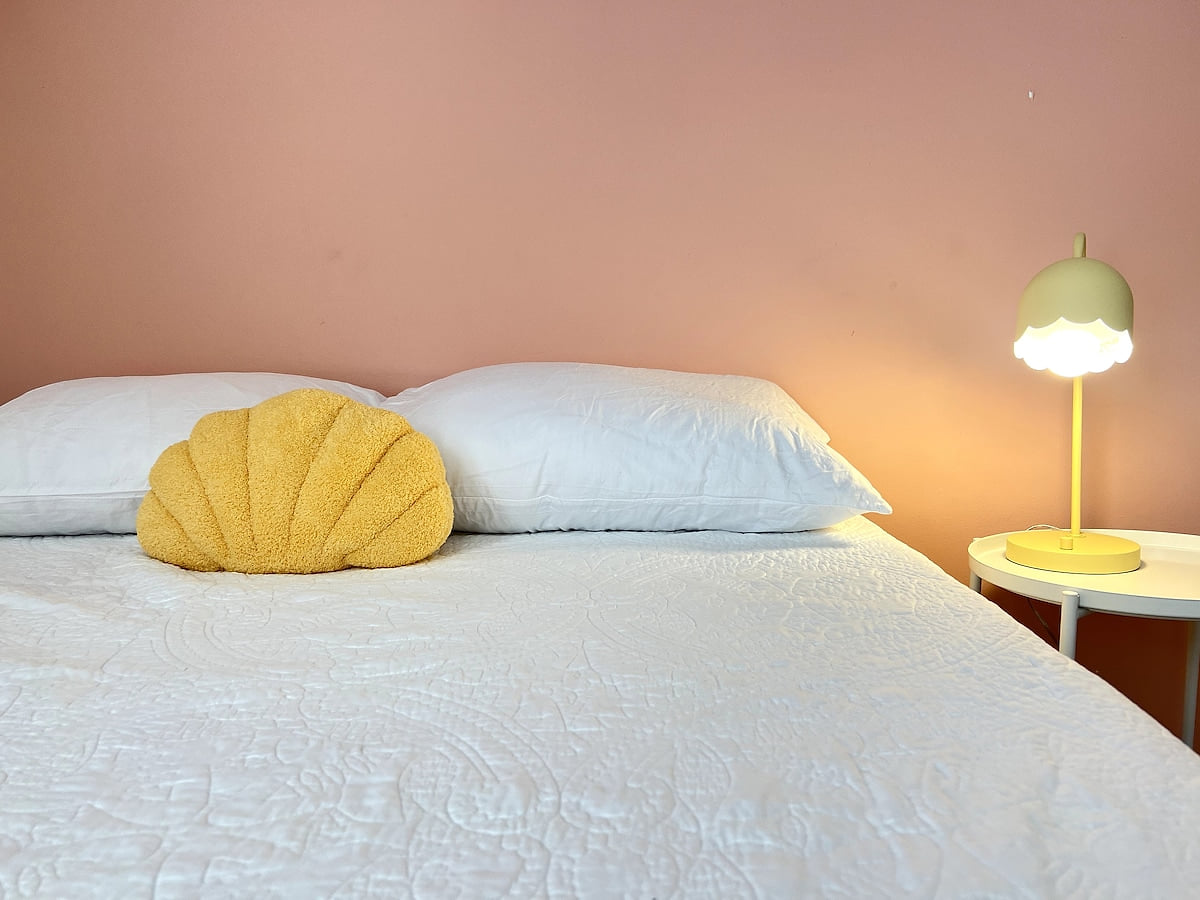 Two full memory foam beds, nightstand lamps for reading bedtime stories, seashell accent pillows - a great place to lay your head after a sun-filled at the beach.