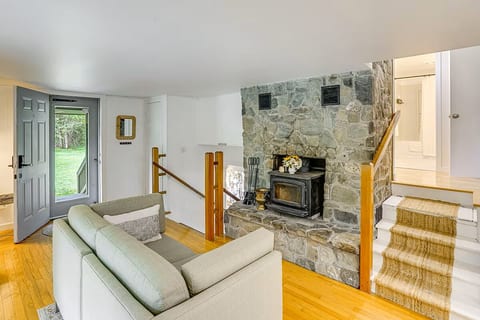 Cozy love seat and fireplace.