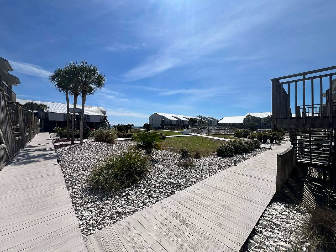 View from boardwalk from J3 towards community pool and Gulf of Mexico board walk to beach