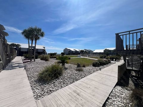 View from boardwalk from J3 towards community pool and Gulf of Mexico board walk to beach