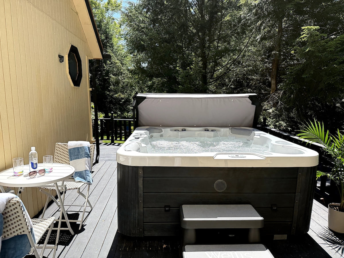 ♨️ Your private spa under the trees—unwind anytime in this spacious hot tub.