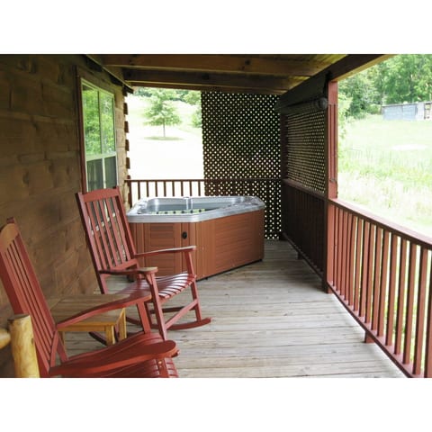 Covered porch with hot tub and rockers. Also a dining table for outdoor meals. Great for relaxing after a day of hiking, visiting local wineries, or a scenic drive on the Blue Ridge Parkway.