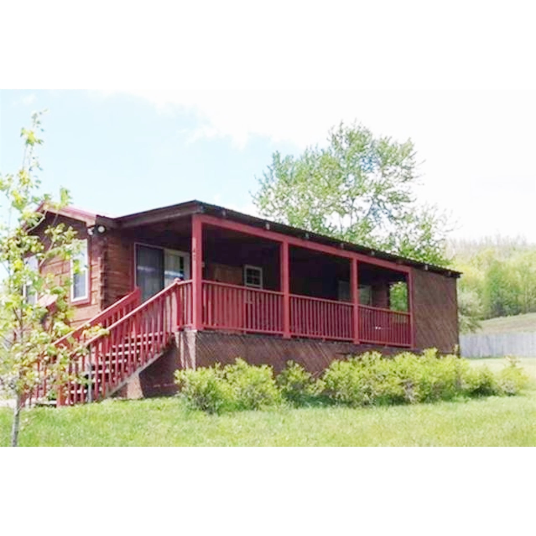 Cabin in the Meadow: Ideal for couples! One bedroom with Queen bed (No footboard), Bathroom with shower/tub, small but well equipped Kitchen, peninsula with stools for dining, Living Room with gas log fireplace and smart TV. Hot tub and rockers on porch.